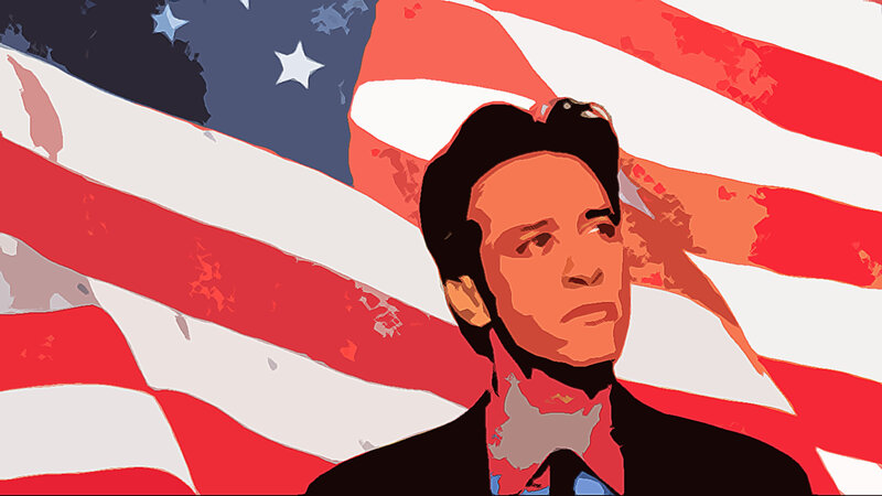 man in front of american flag