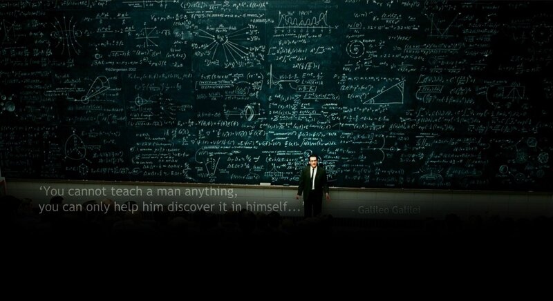 man in front of chalkboard
