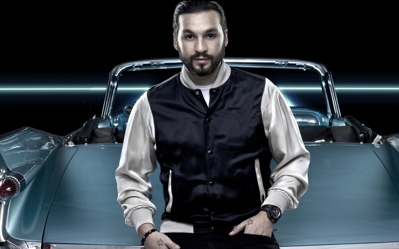 man in front of classic car