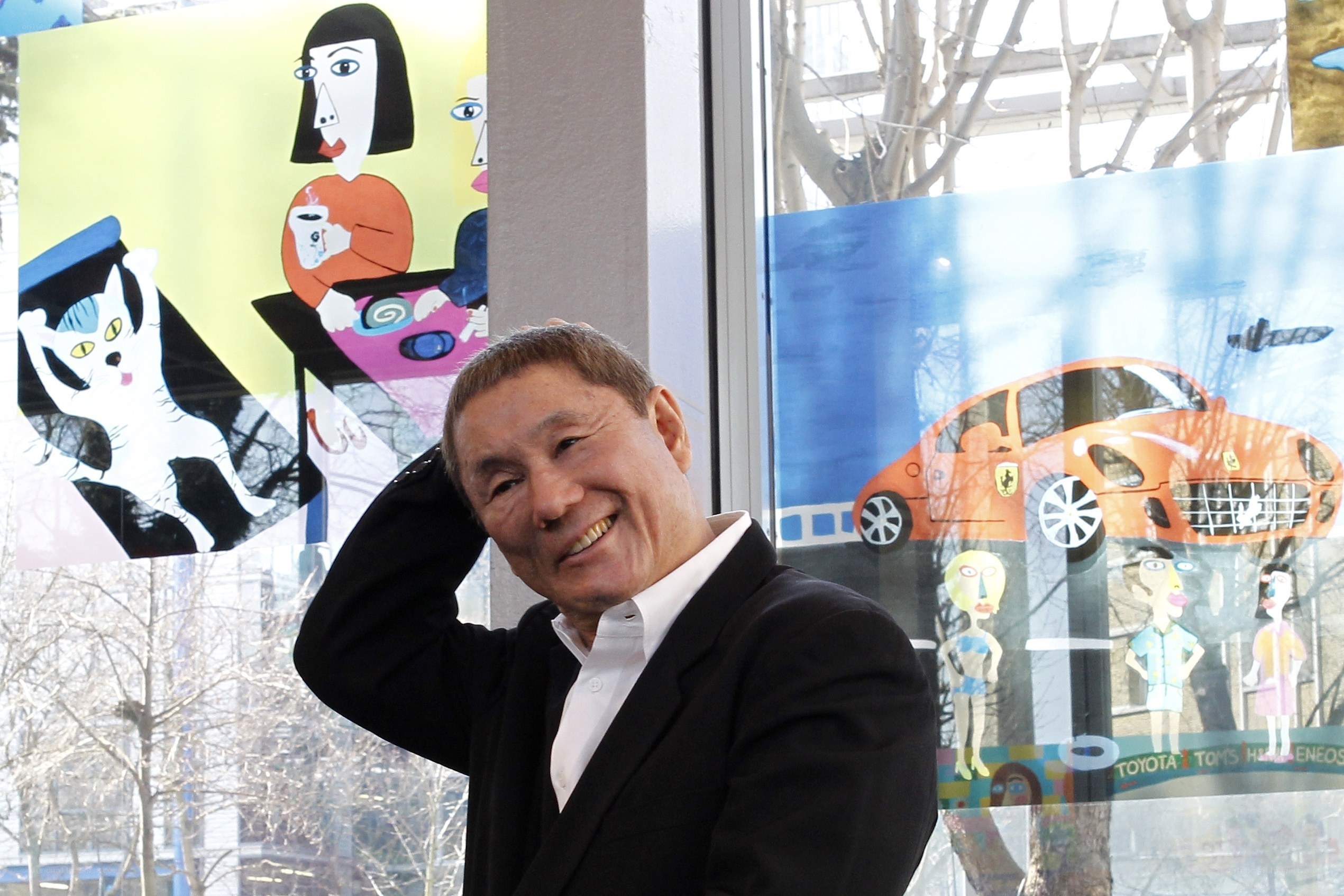 Man in front of colorful art