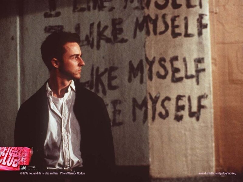man in front of graffiti wall