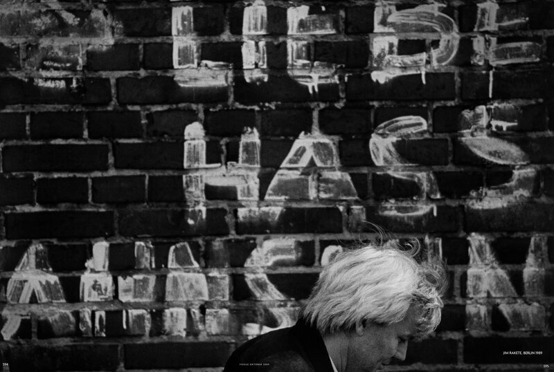 Man in front of graffiti wall