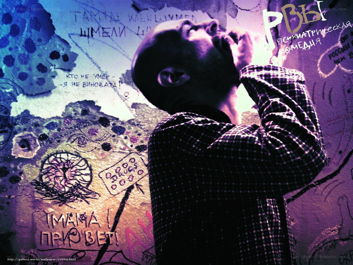 man in front of graffiti wall