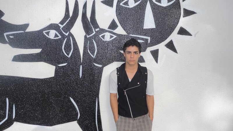 man in front of mural