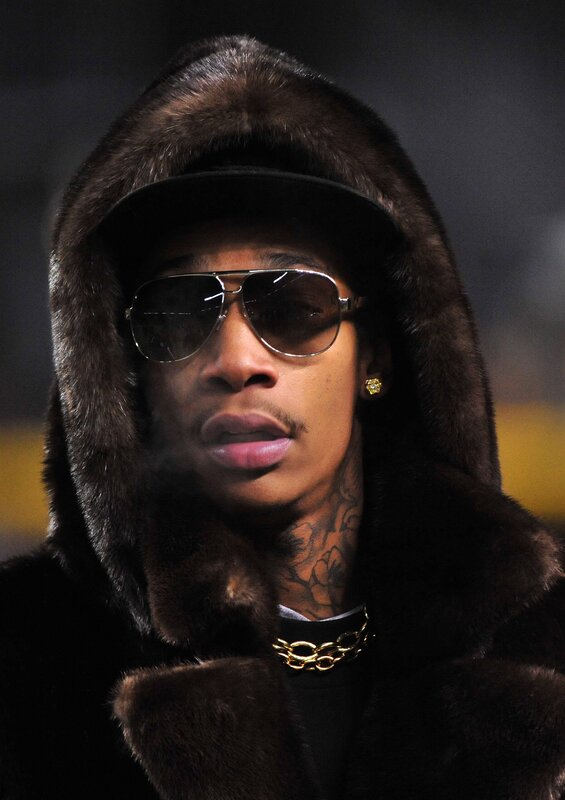 man in fur coat and sunglasses