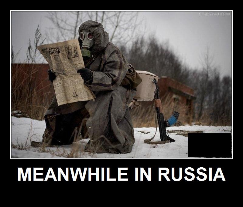 man in gas mask reading newspaper