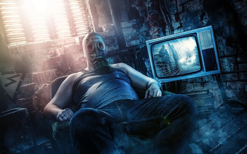 man in gas mask watching TV