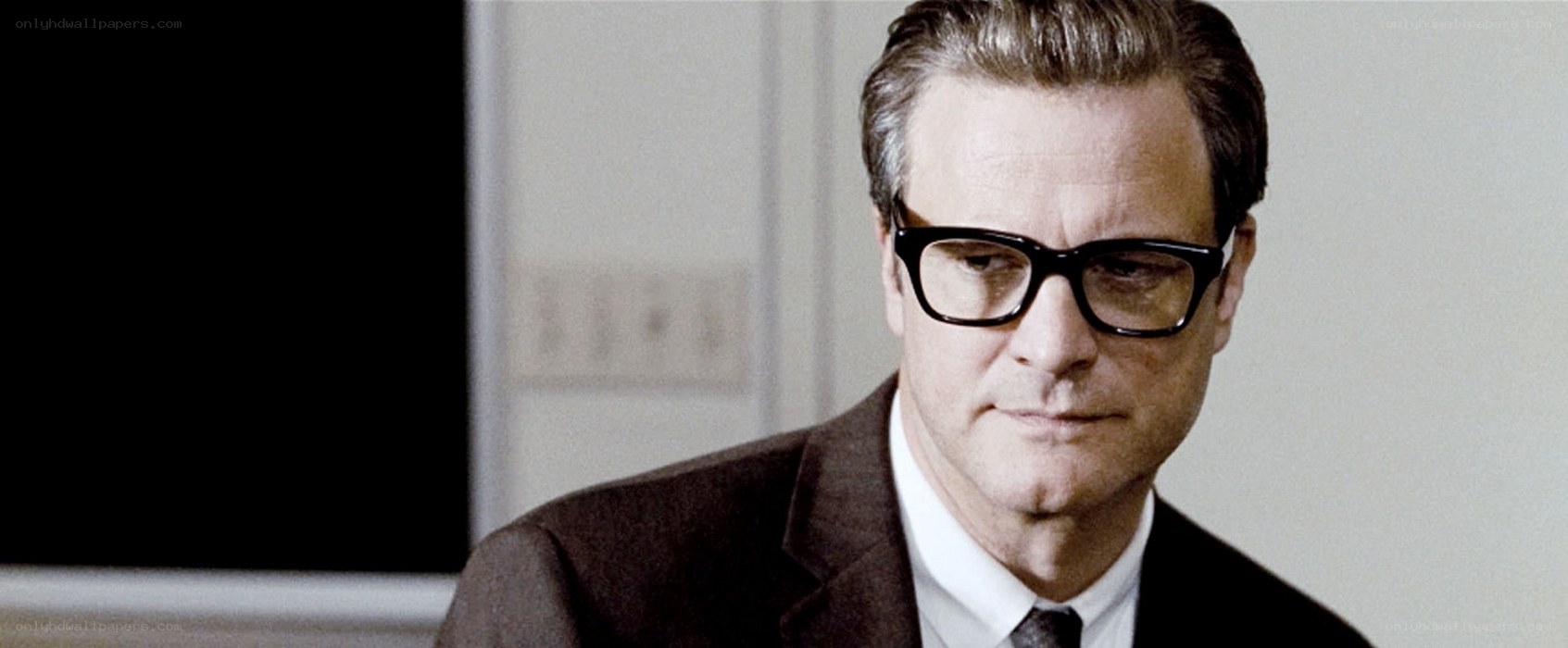 man in glasses and suit