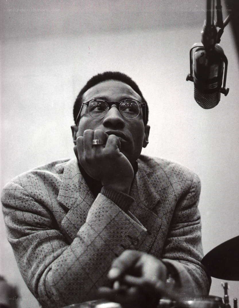 man in glasses at microphone