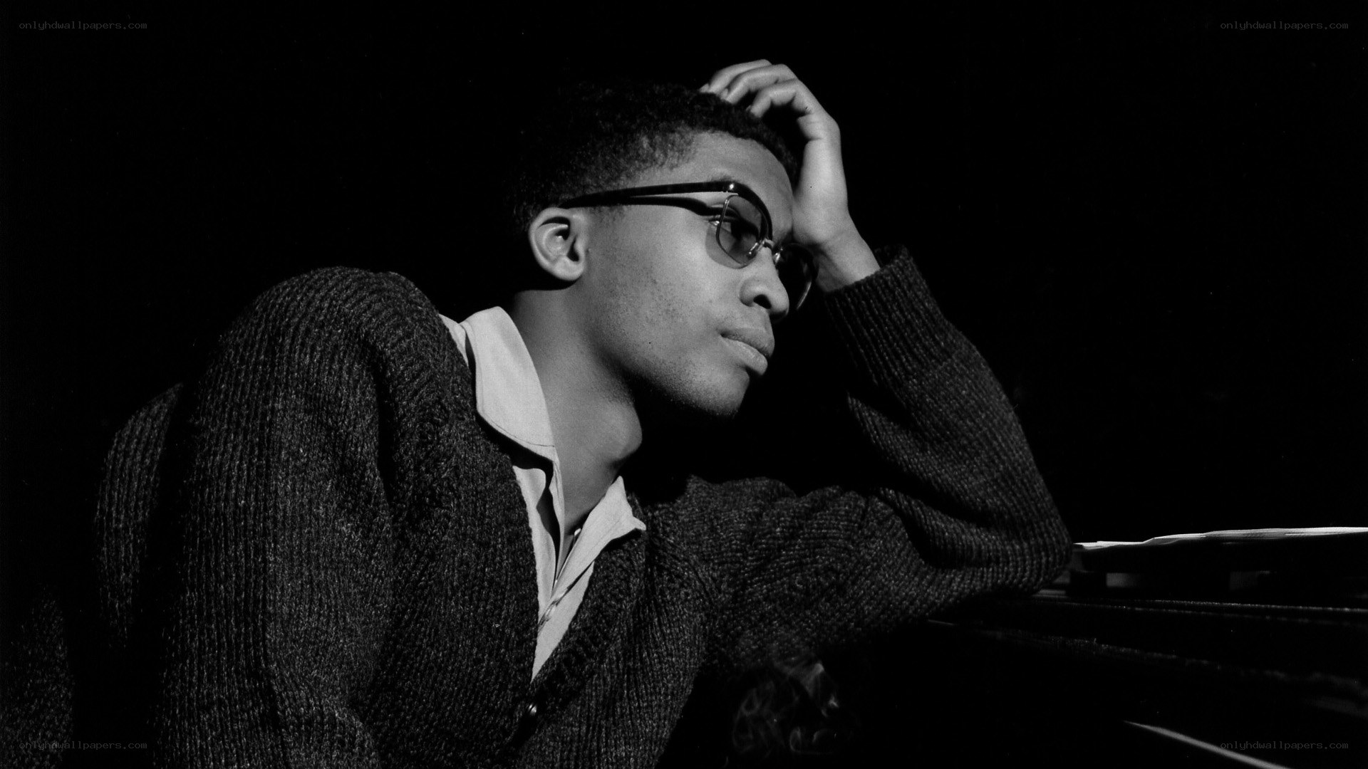 man in glasses at piano