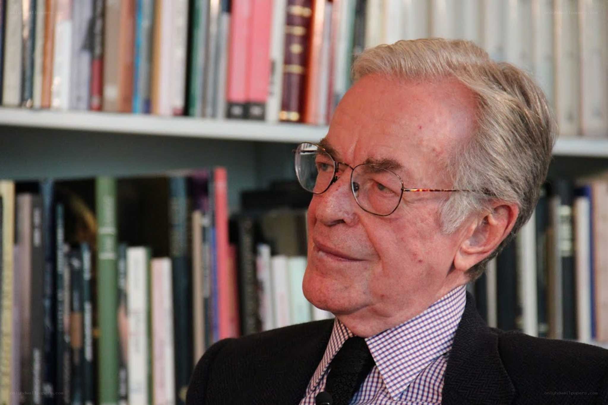 man in glasses in library