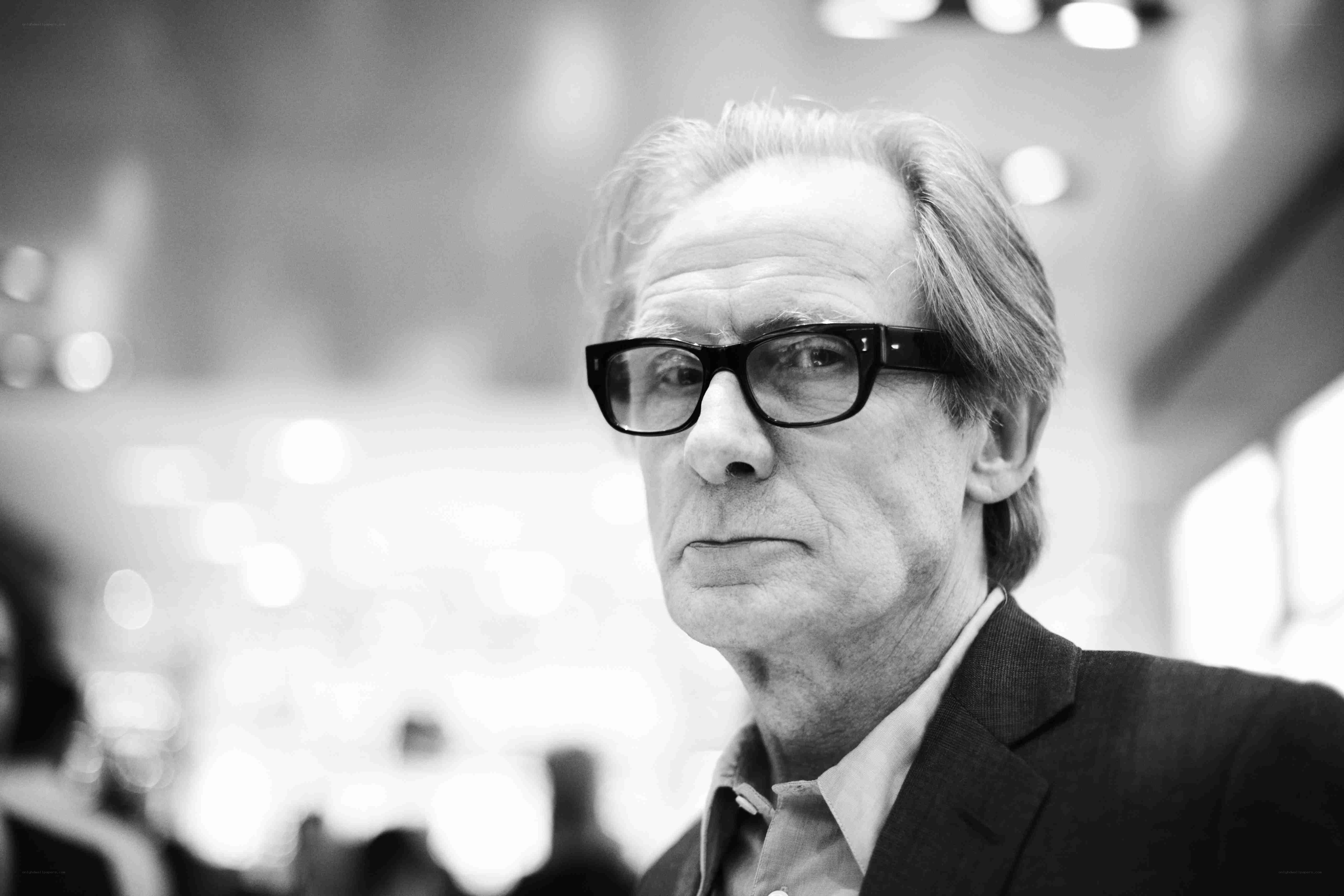 man in glasses looking away