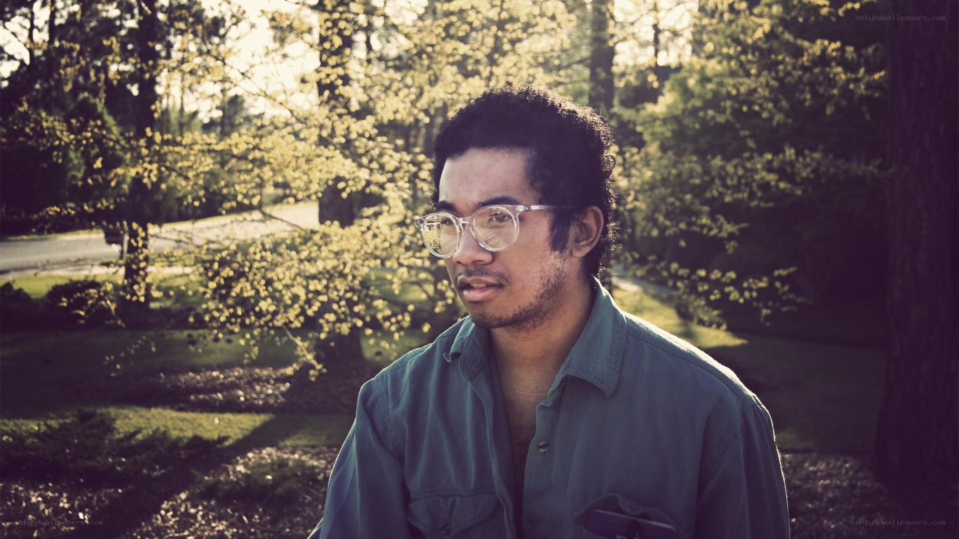 man in glasses outdoors