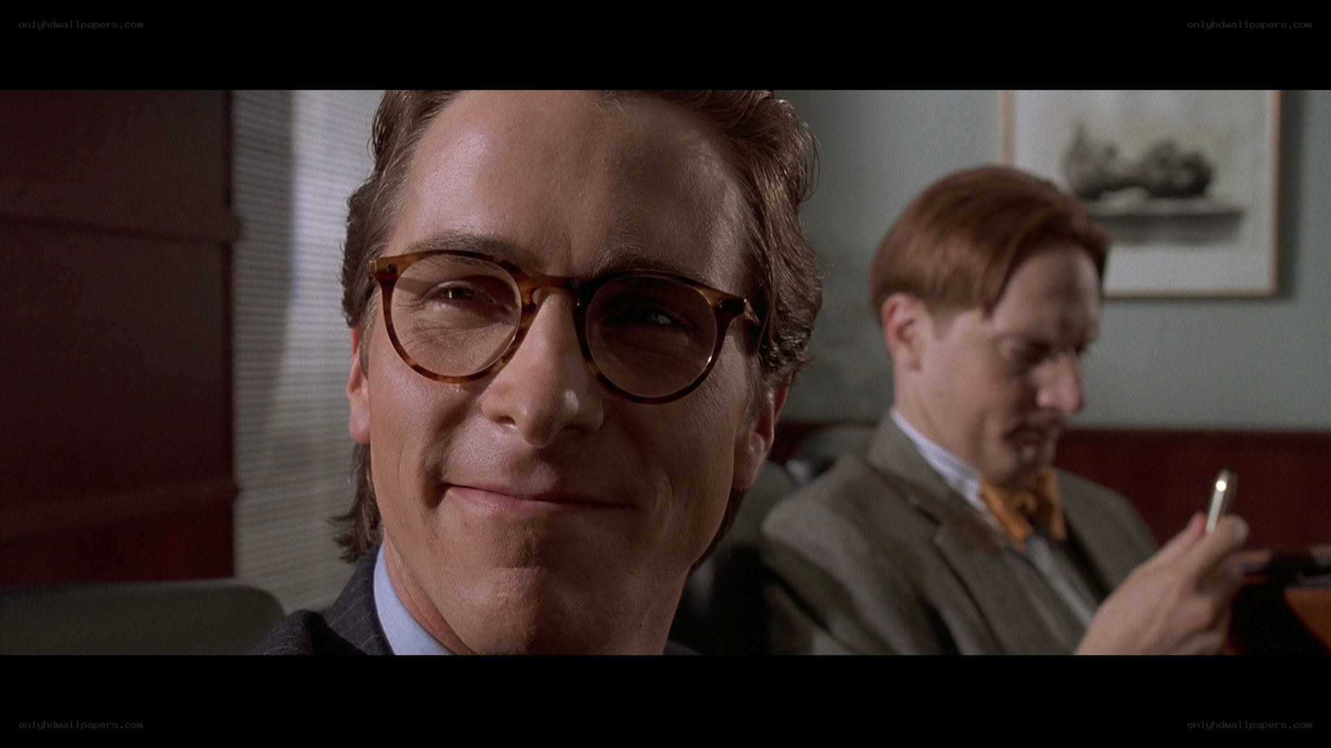 man in glasses smiling