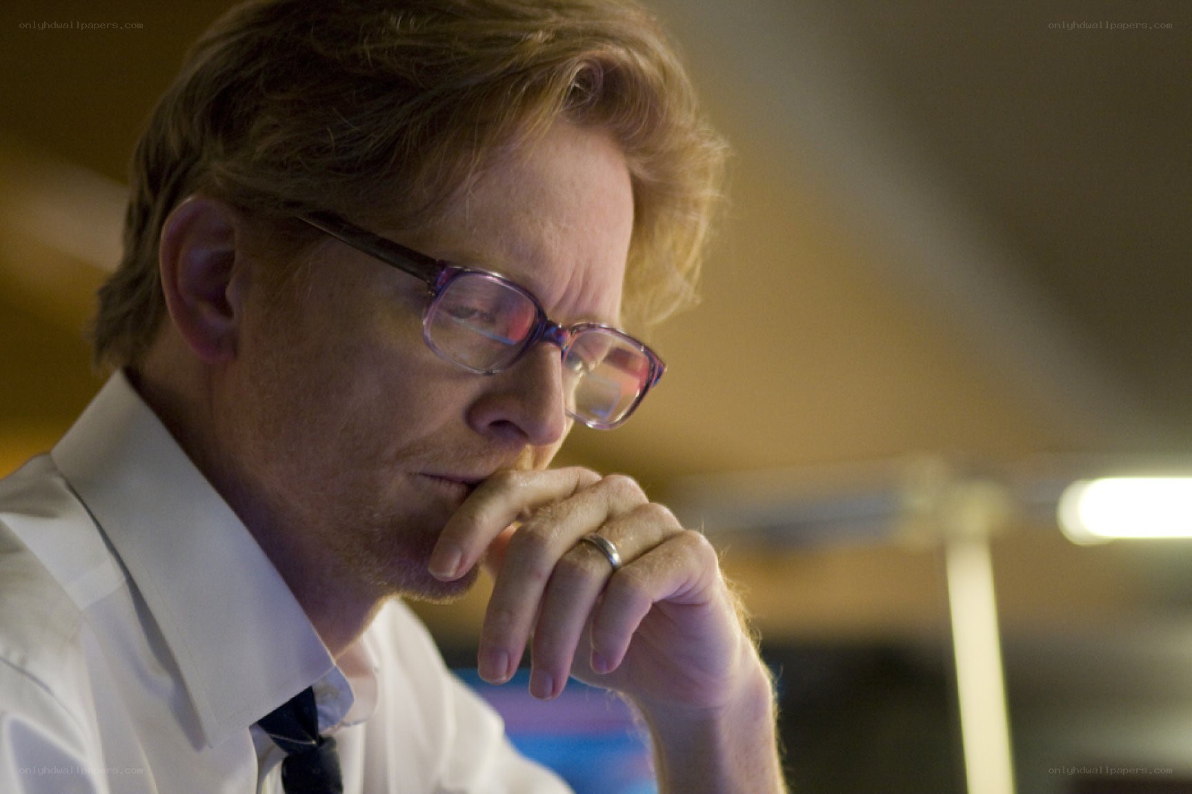 man in glasses thinking