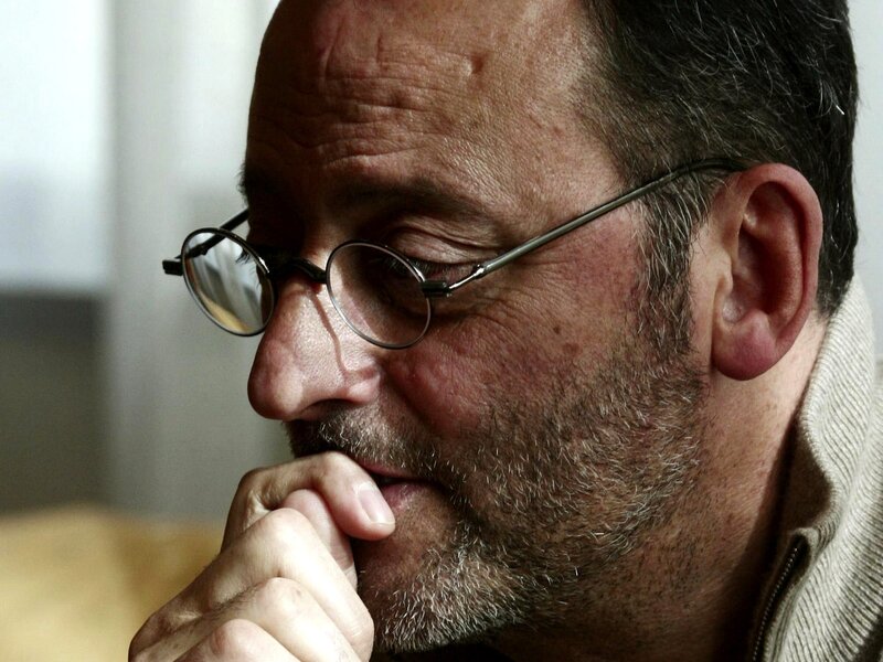 man in glasses thinking