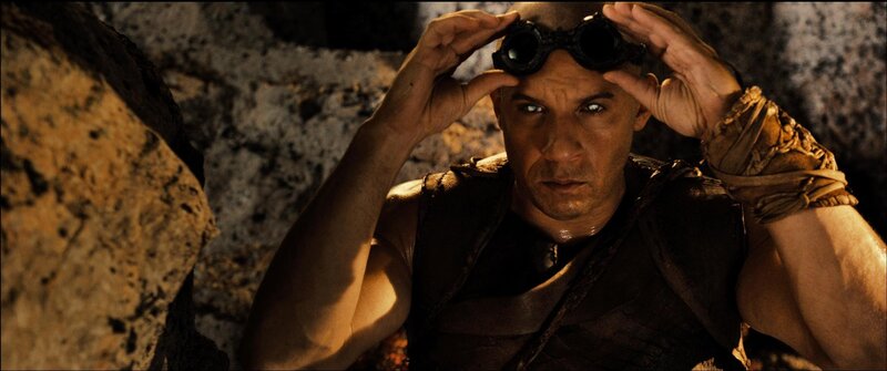 man in goggles looking up
