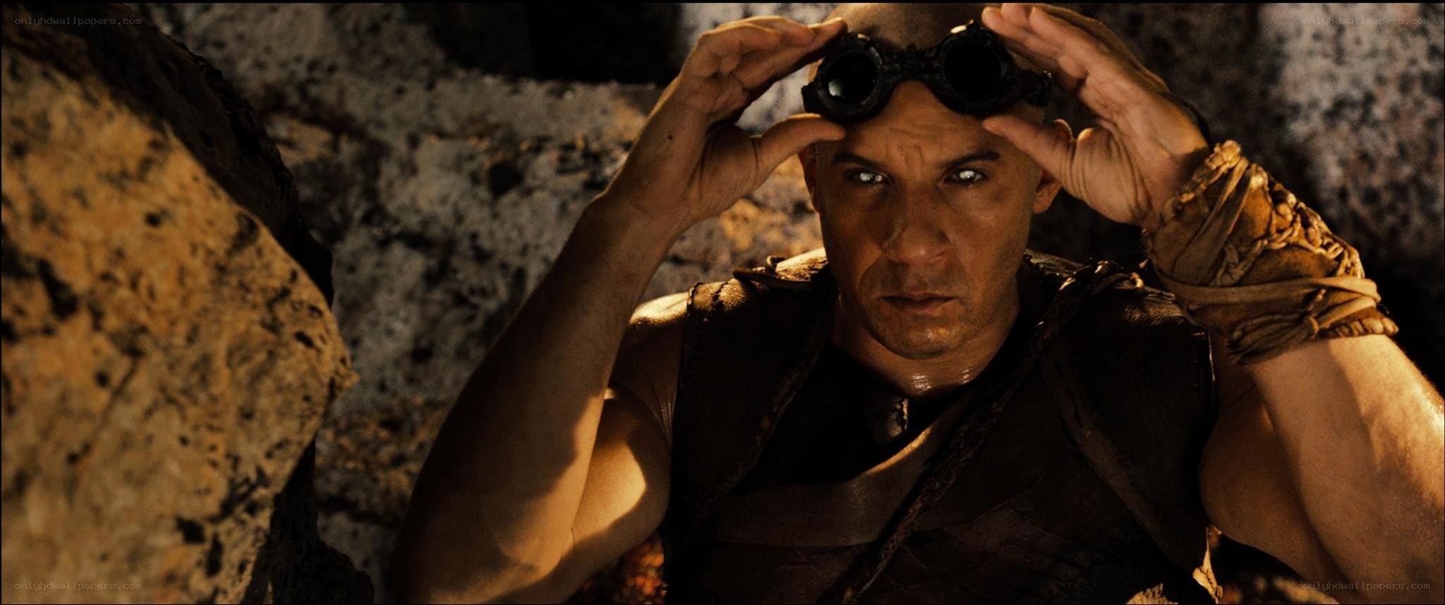 man in goggles looking up