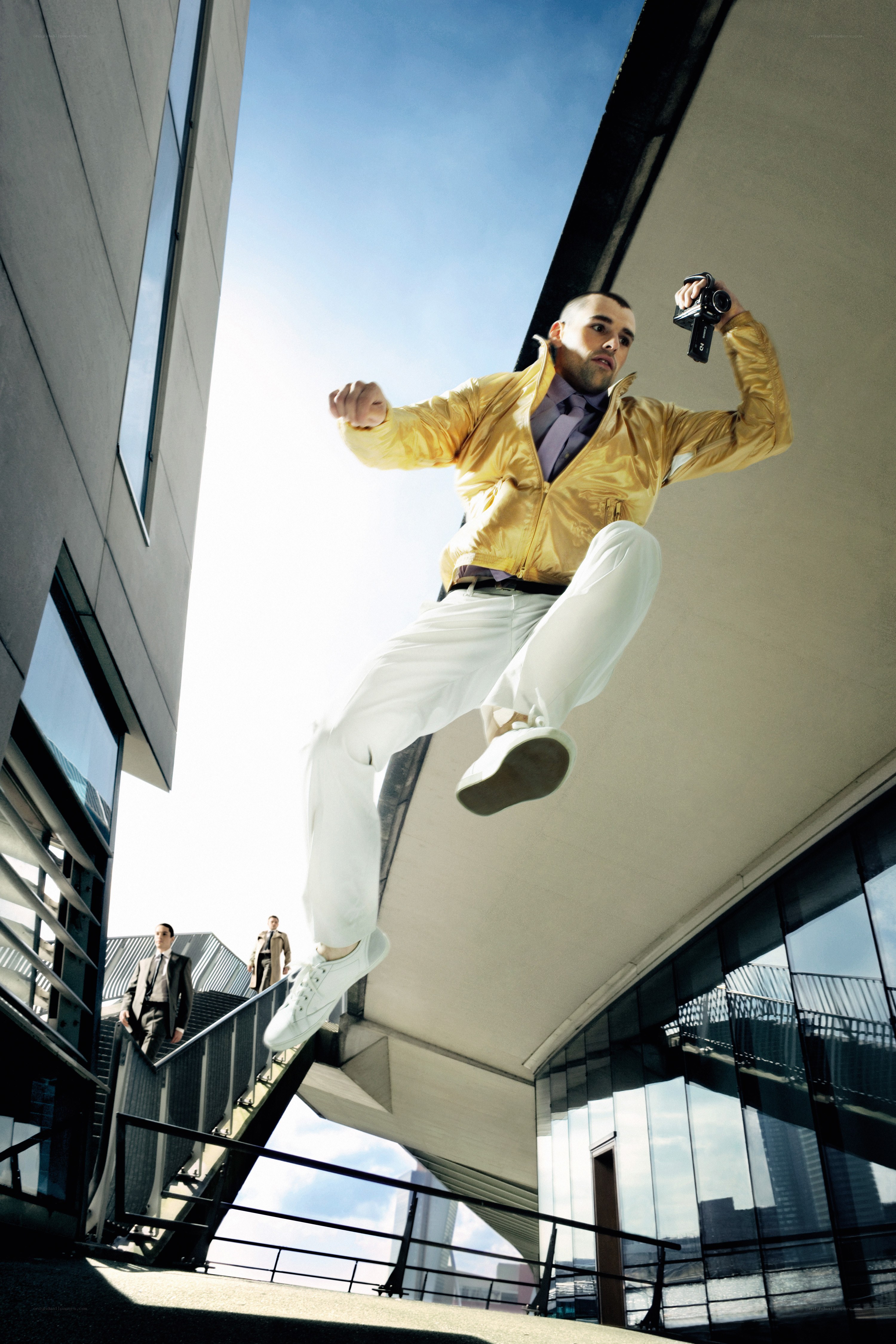 Man in gold jacket jumping