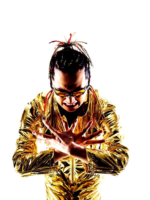 Man in gold jacket with sunglasses