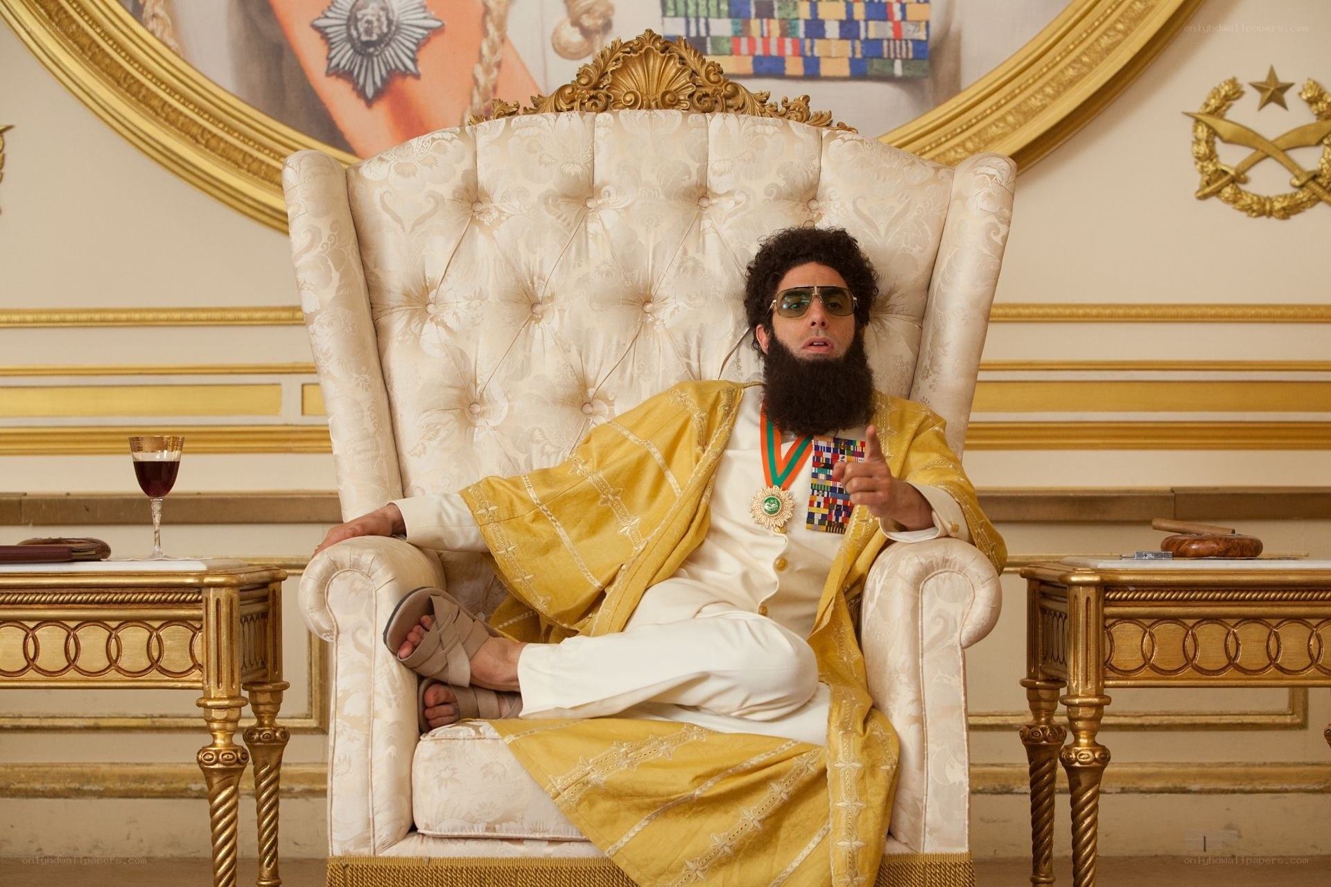 Man in gold robe on throne