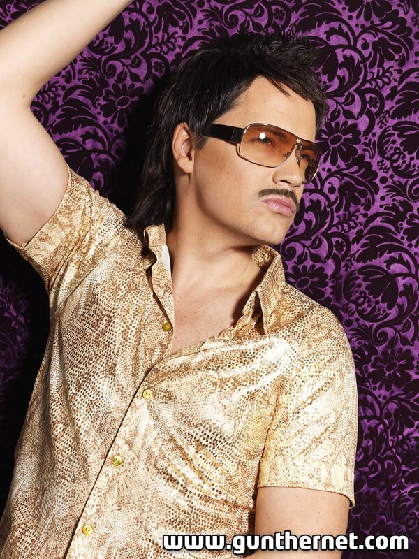 Man in gold shirt and sunglasses