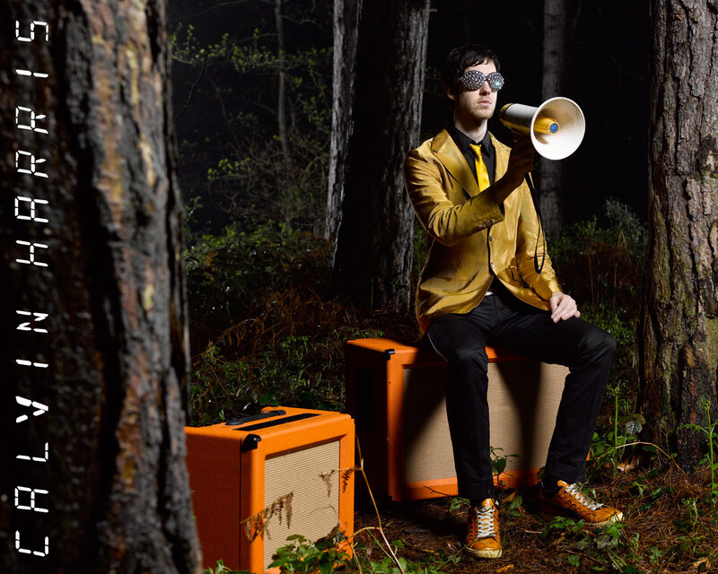 Man in gold suit with megaphone