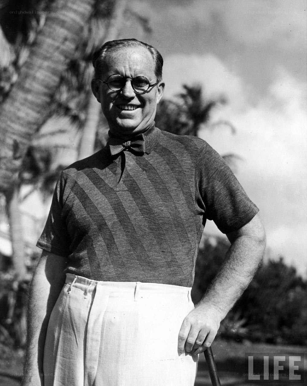 Man in golf attire smiling