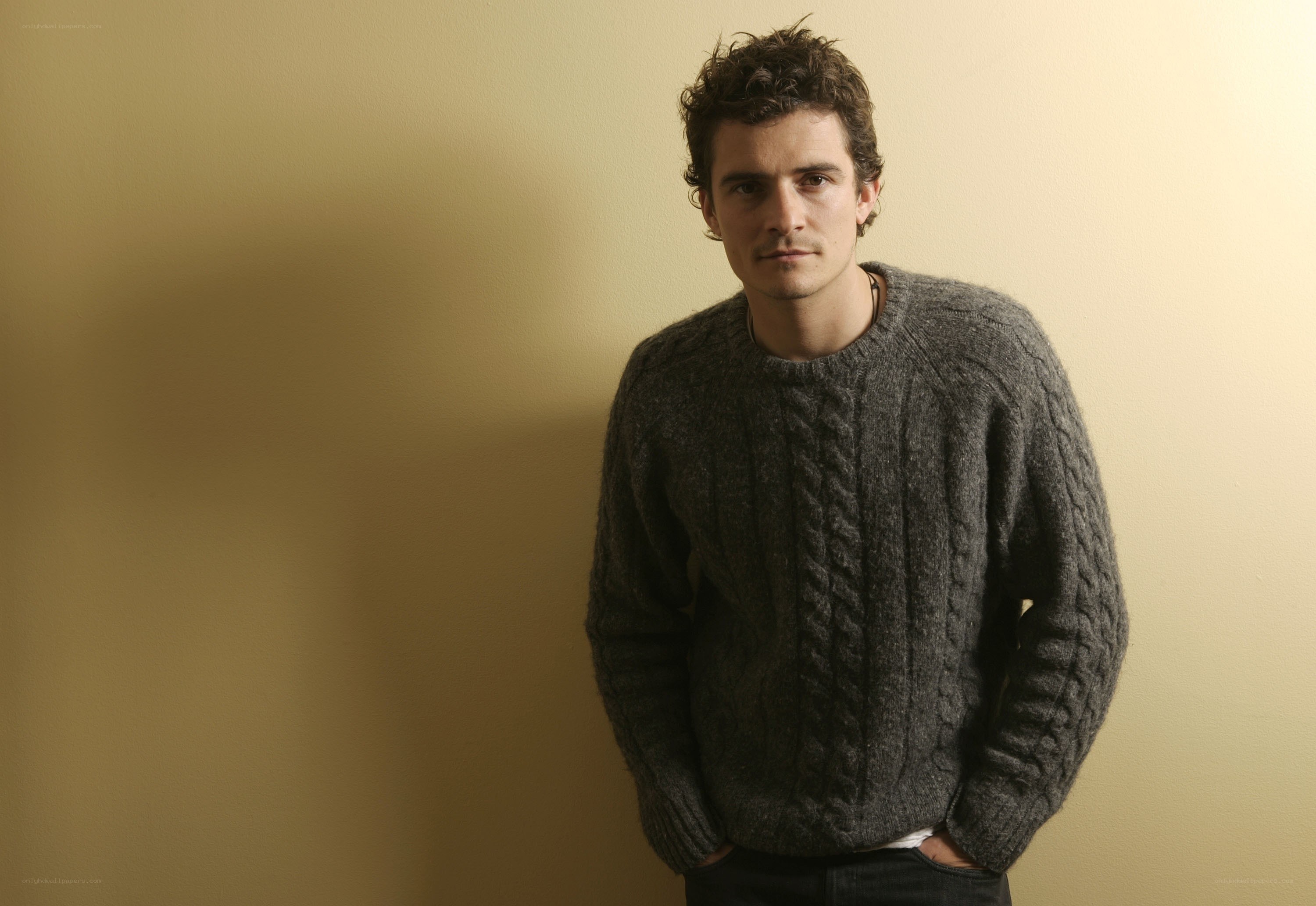 man in gray cable-knit sweater