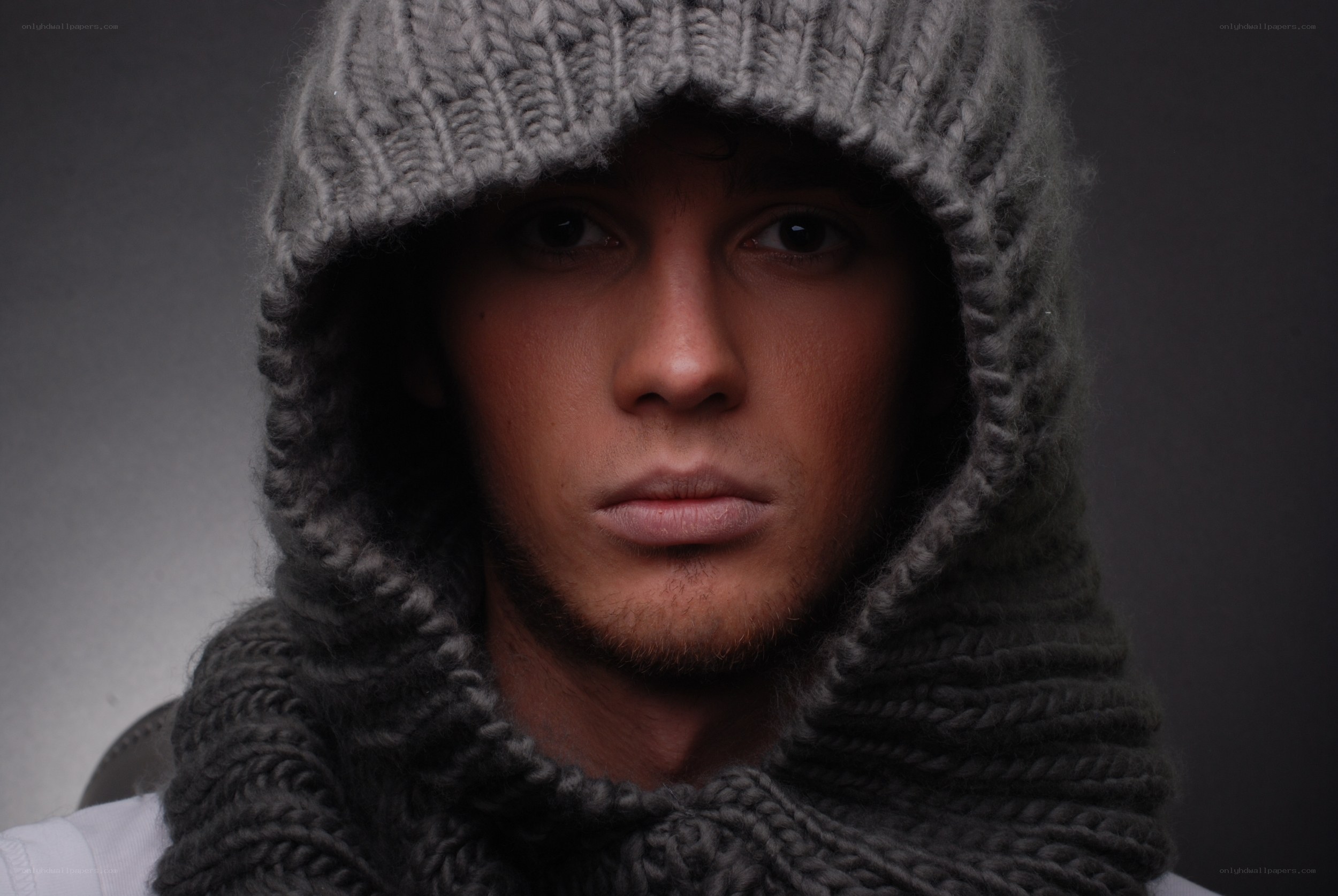 man in gray knit hood