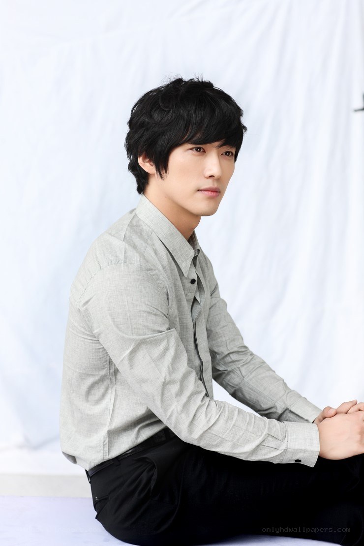 man in gray shirt sitting