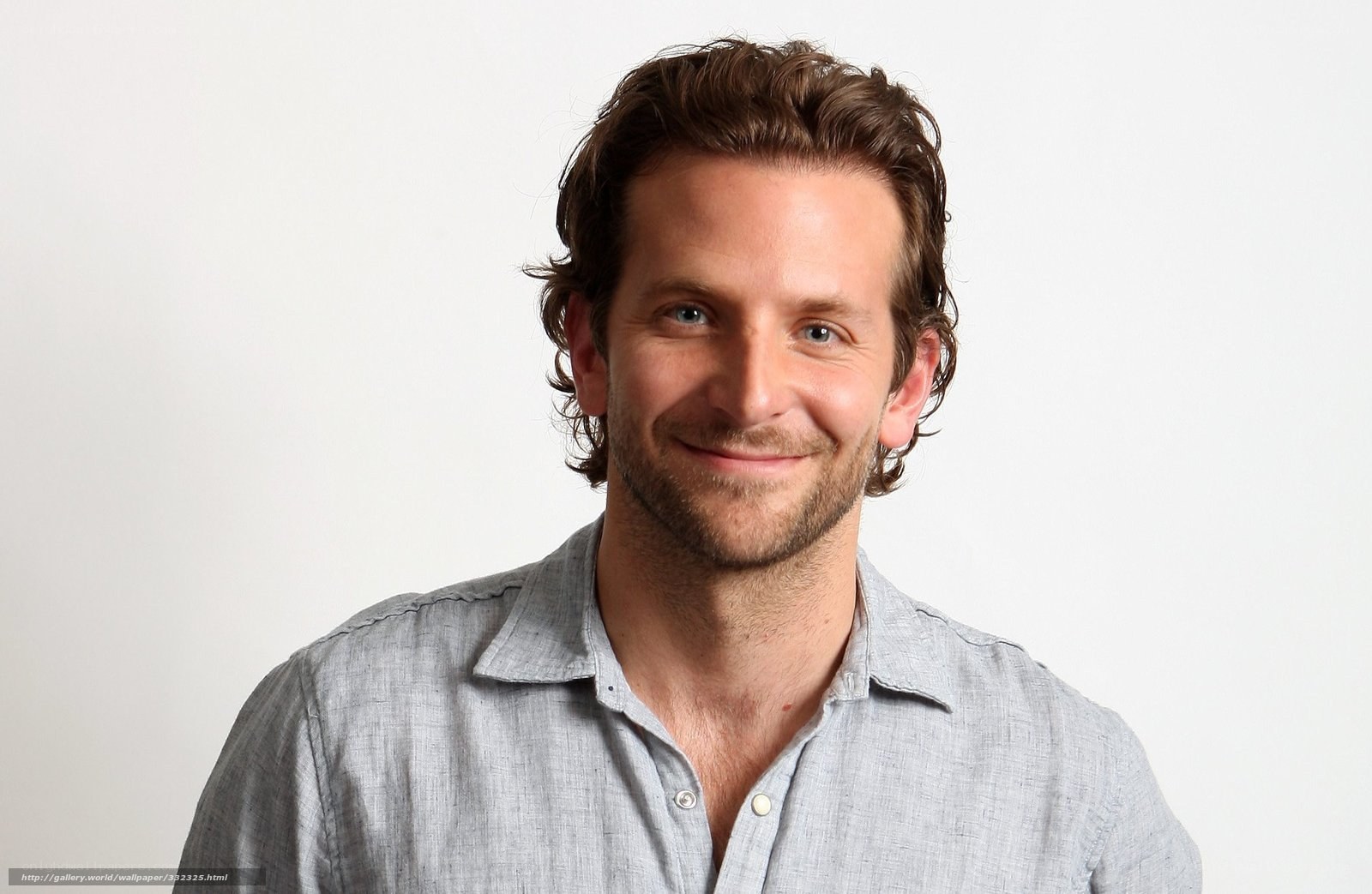 man in gray shirt smiling
