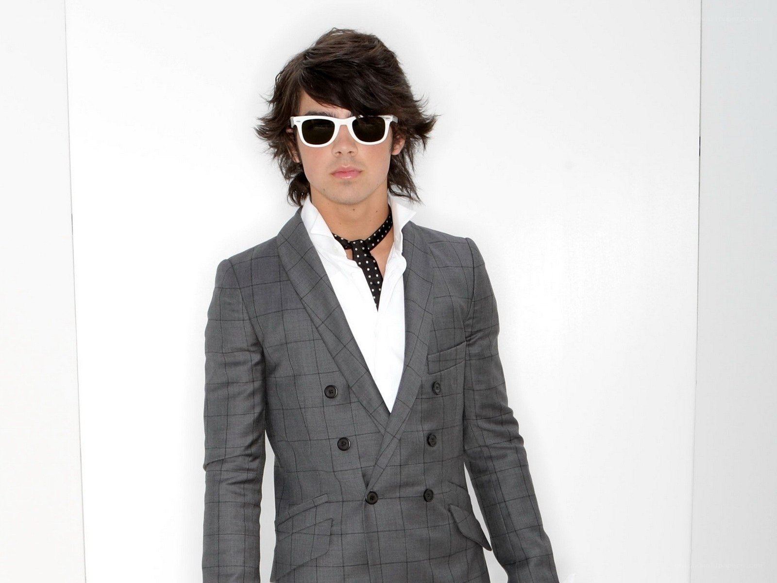 man in gray suit and sunglasses