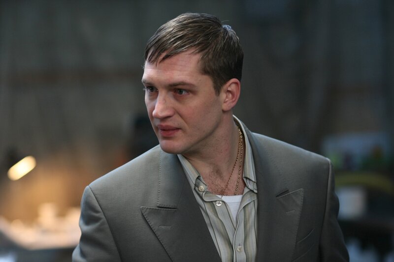 man in gray suit looking away