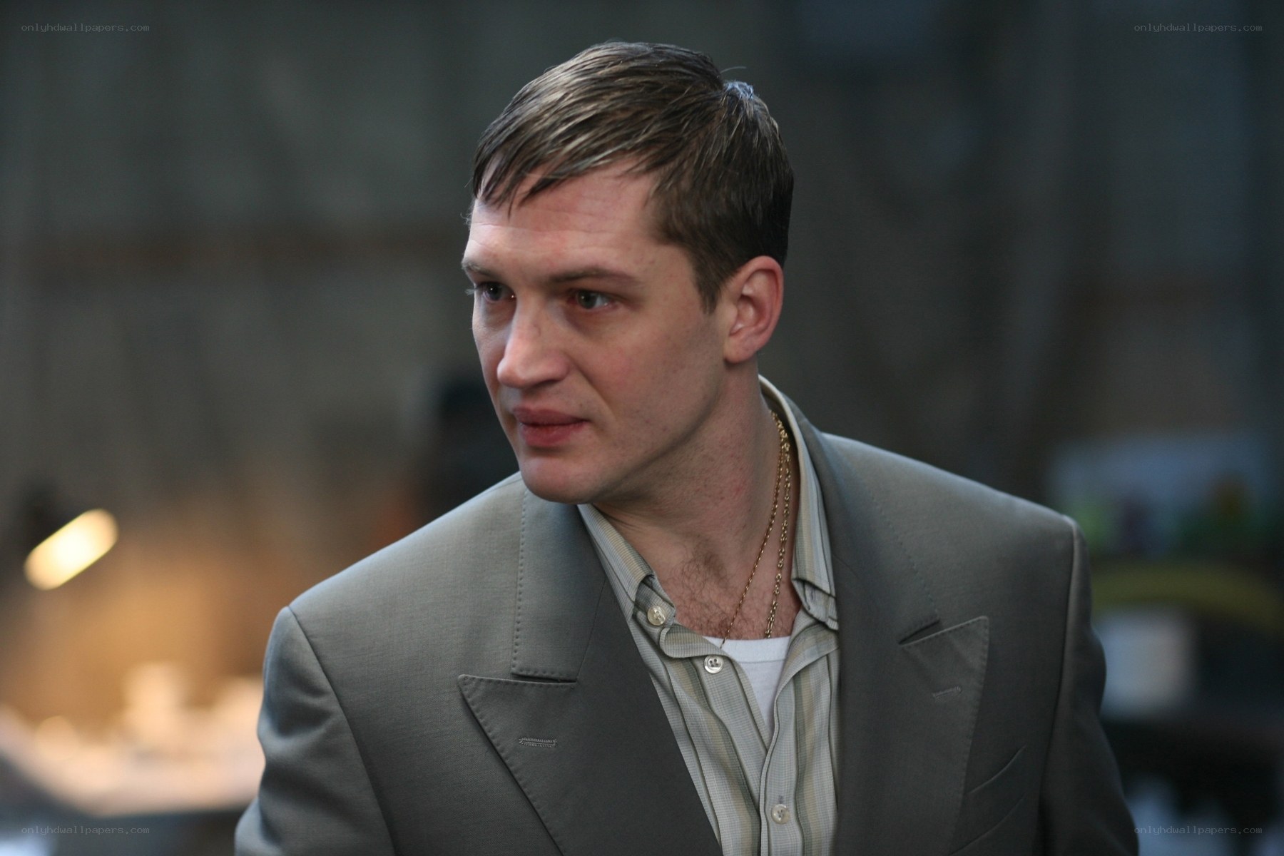 man in gray suit looking away