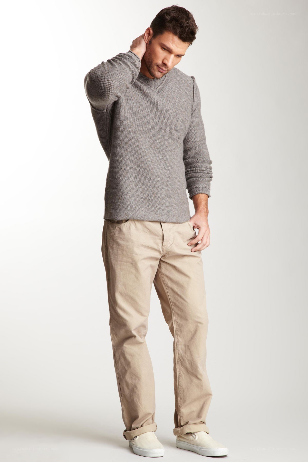 man in gray sweater and khakis