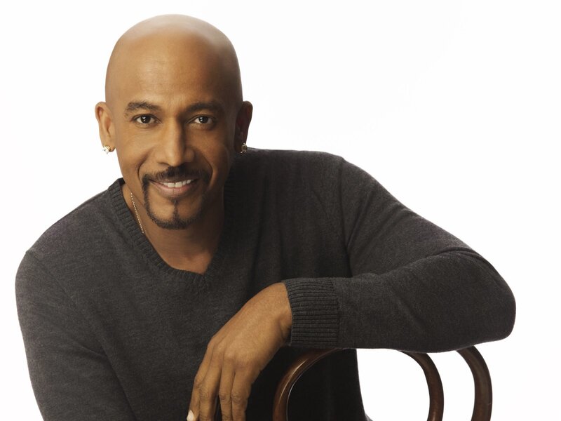 Man in gray sweater smiling
