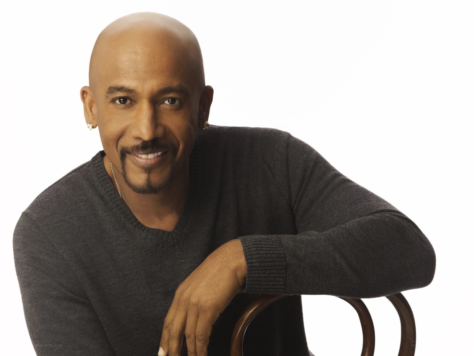 Man in gray sweater smiling