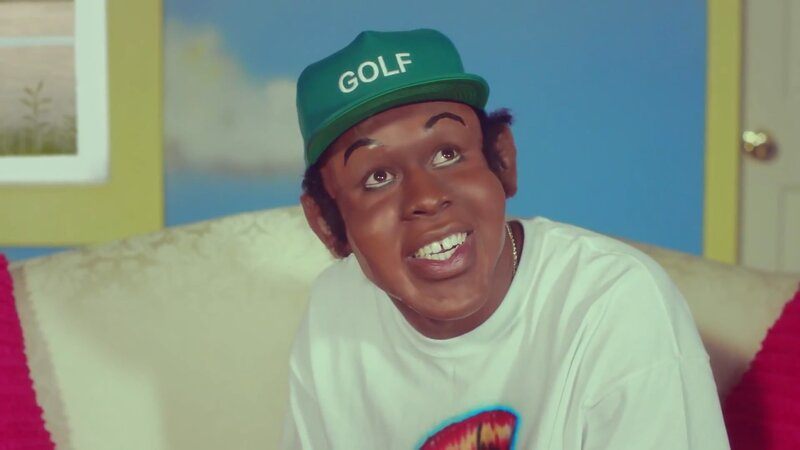 man in green cap smiling