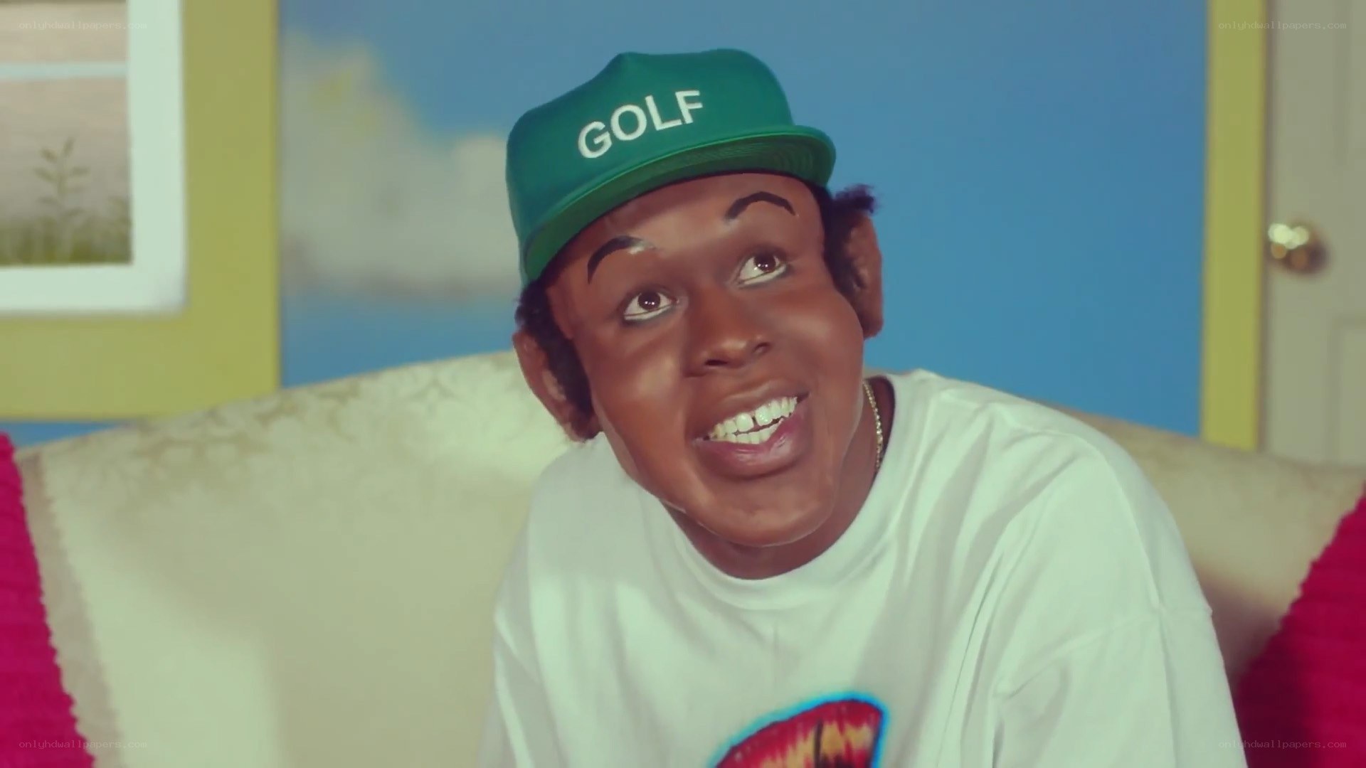 man in green cap smiling