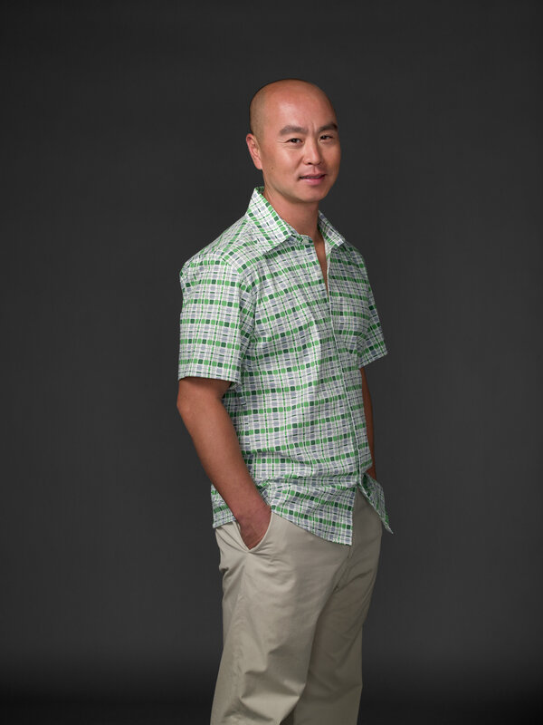 man in green checkered shirt