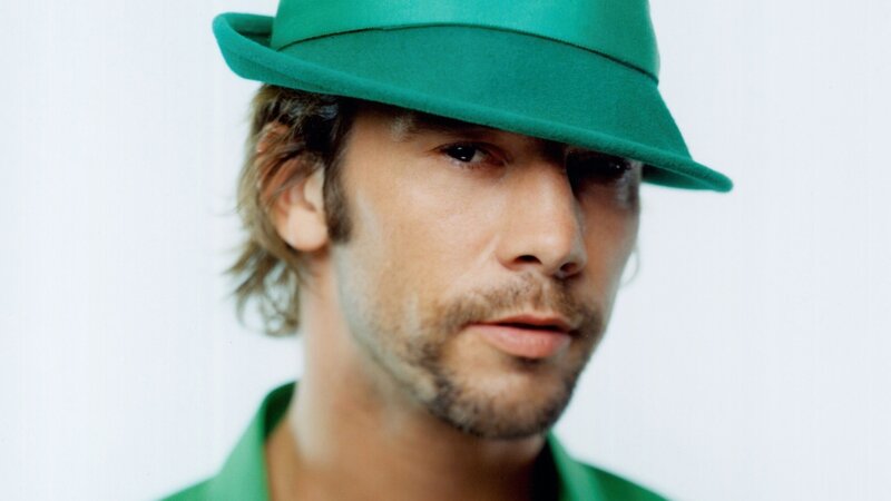 man in green hat