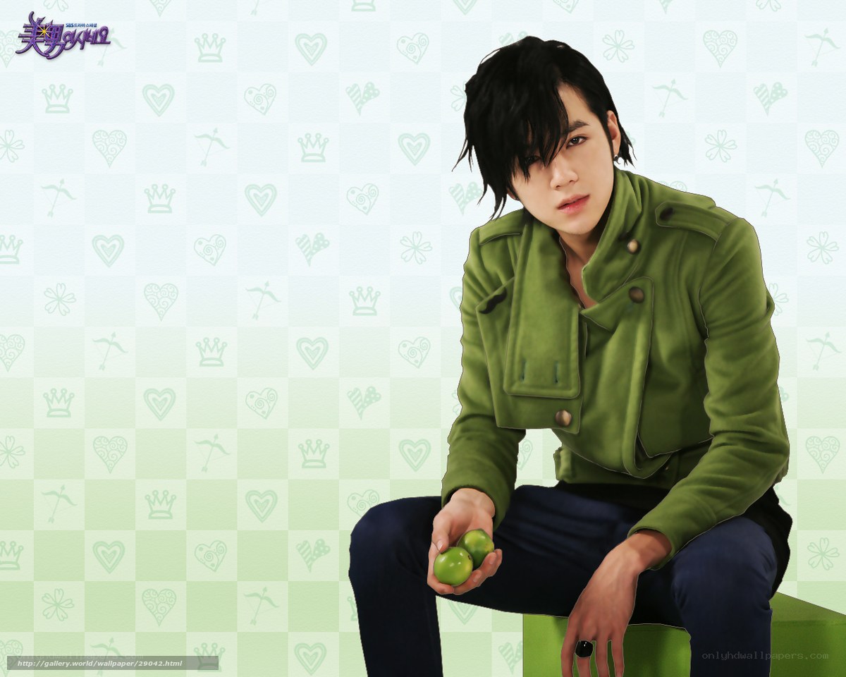 man in green jacket holding apples