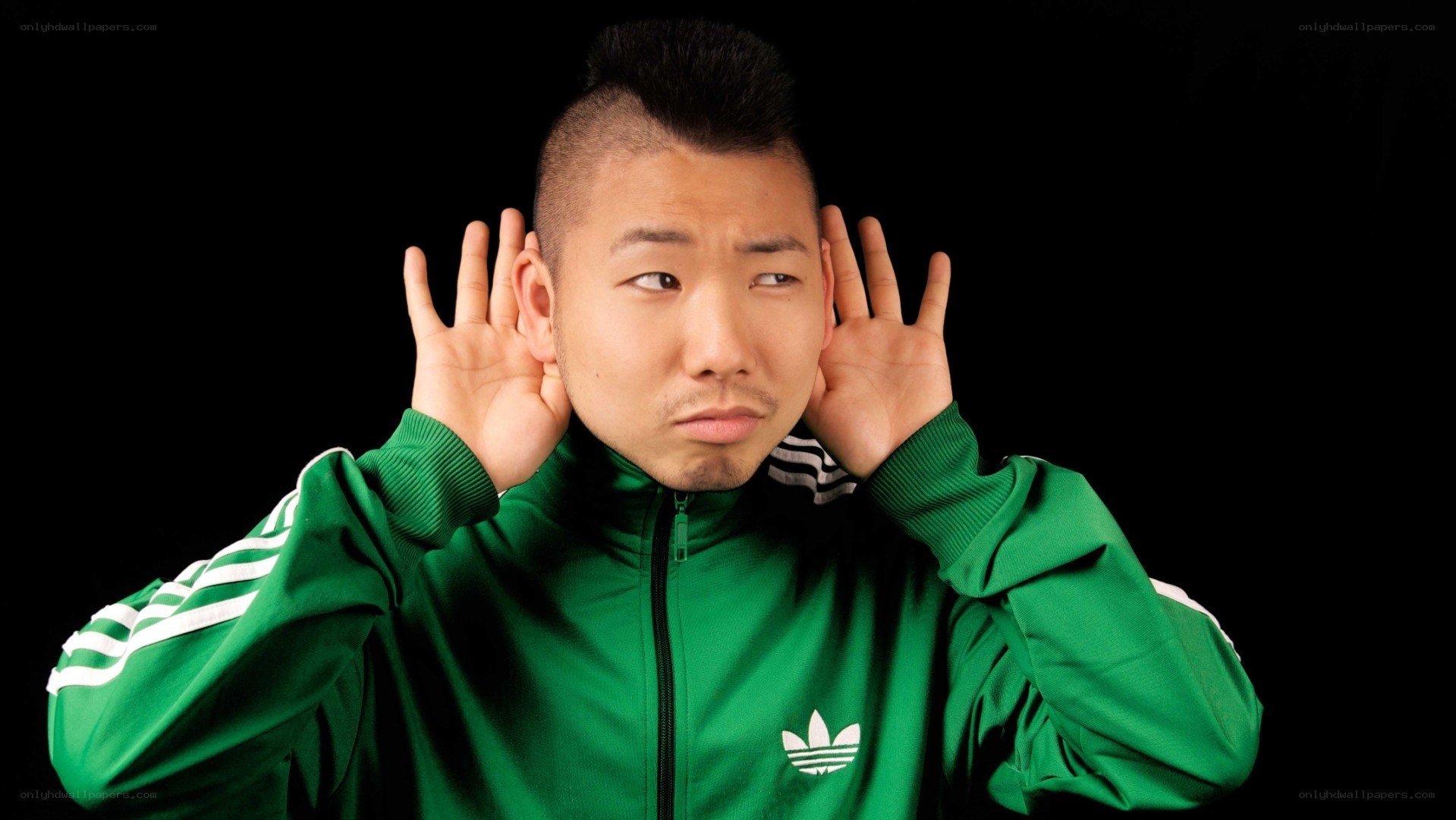 man in green jacket listening