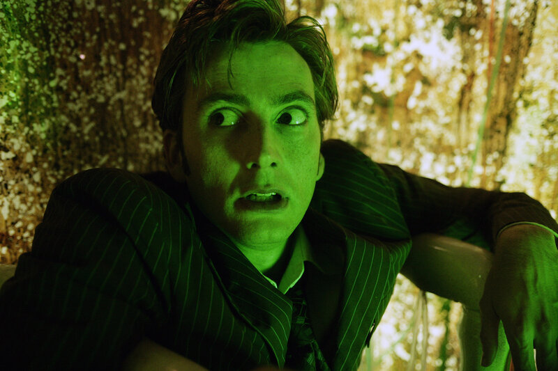 man in green light