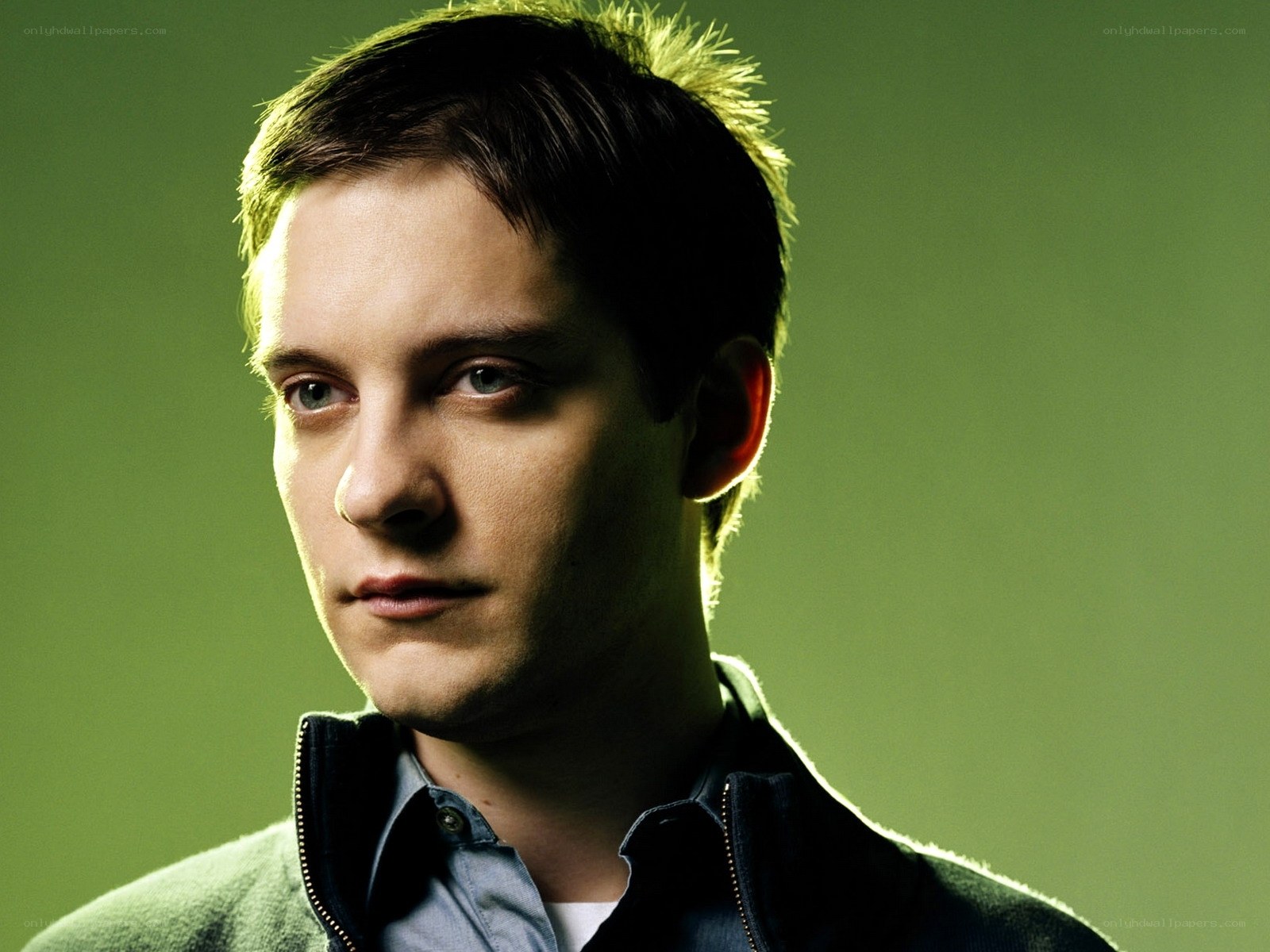 man in green-lit portrait