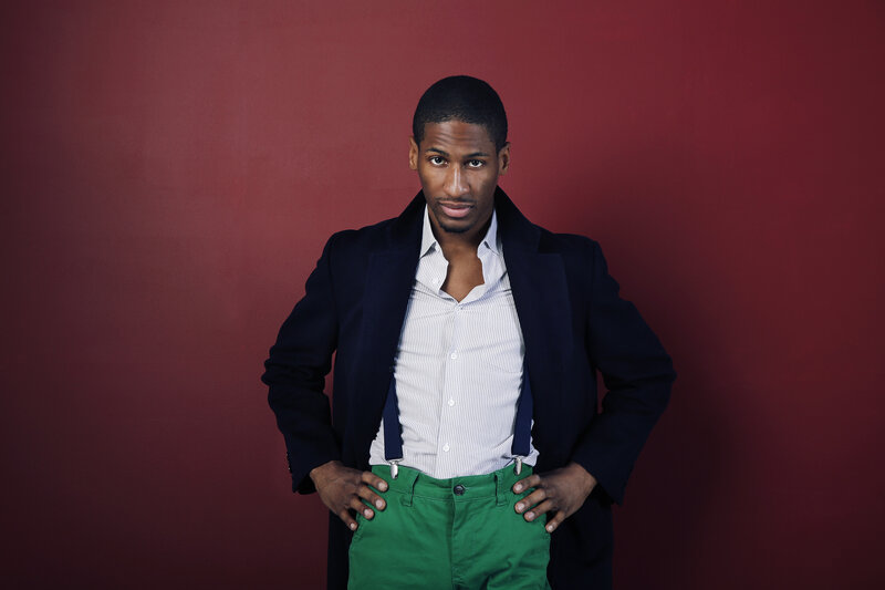 man in green pants and coat