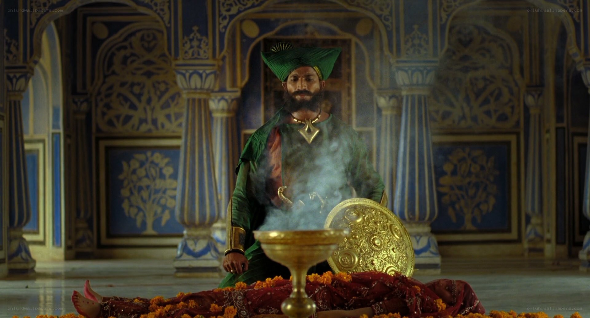 Man in green robe with smoke