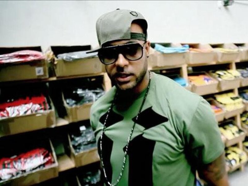 Man in green shirt and cap