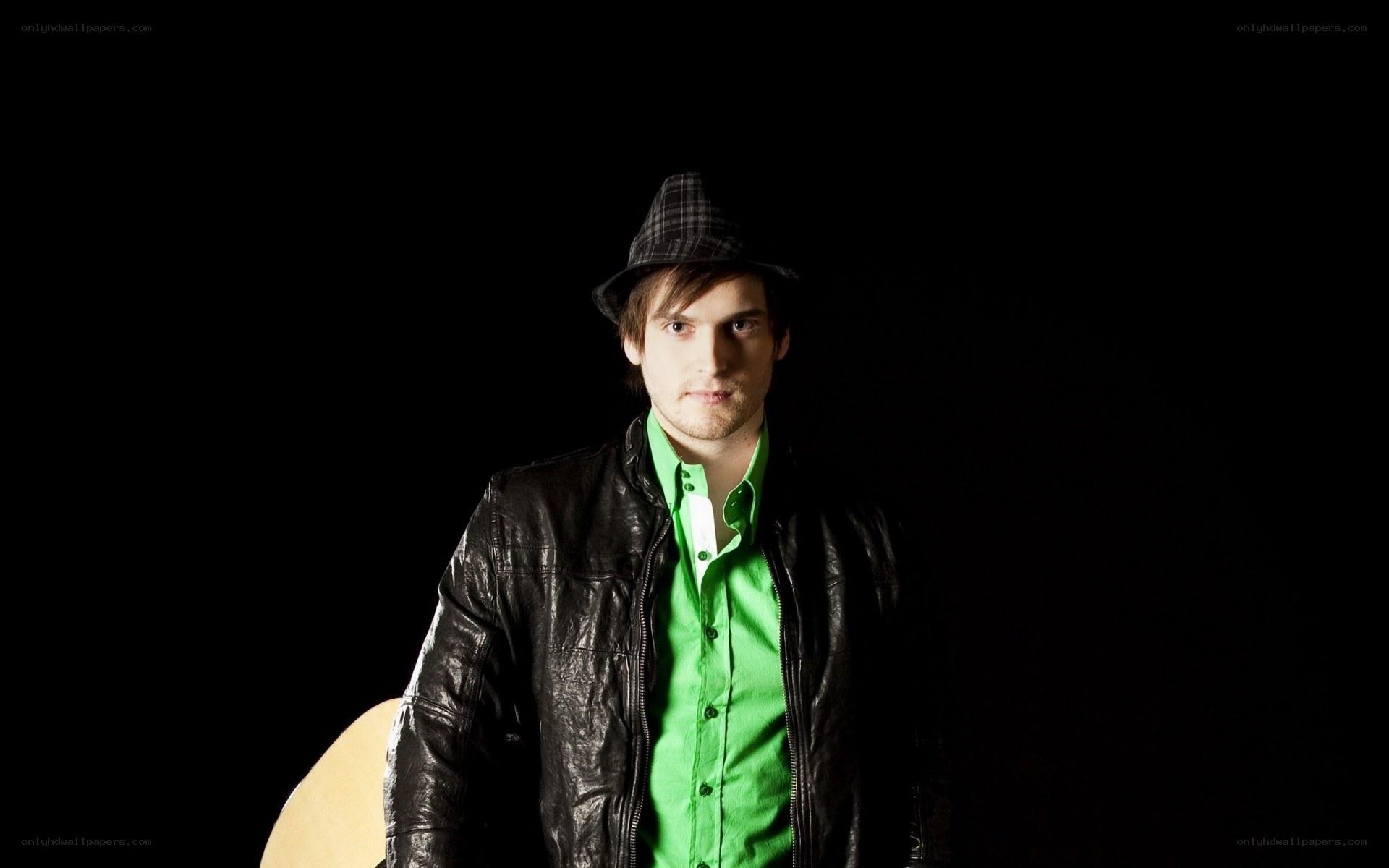 man in green shirt and hat